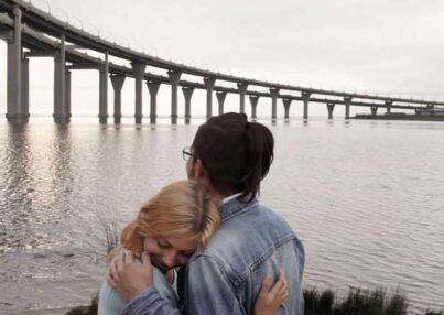 man-hugging-woman-near-sea-2324394