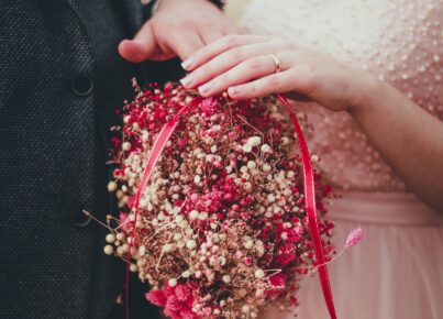 woman-holding-red-and-pink-bouquet-3647317